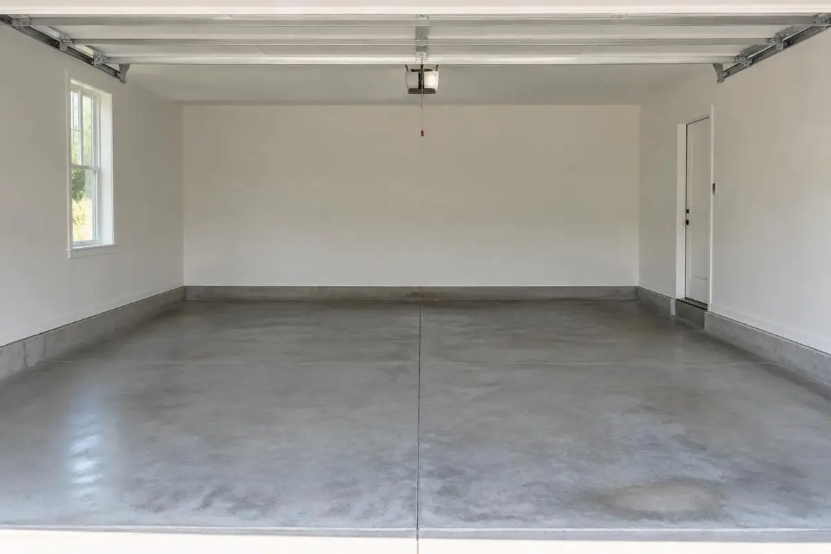 Garage after cleanout, empty and swept